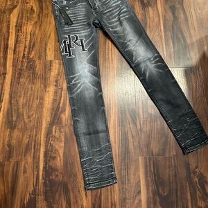 AMIRI Black Washed Skinny Jeans with White Embroidered Logo